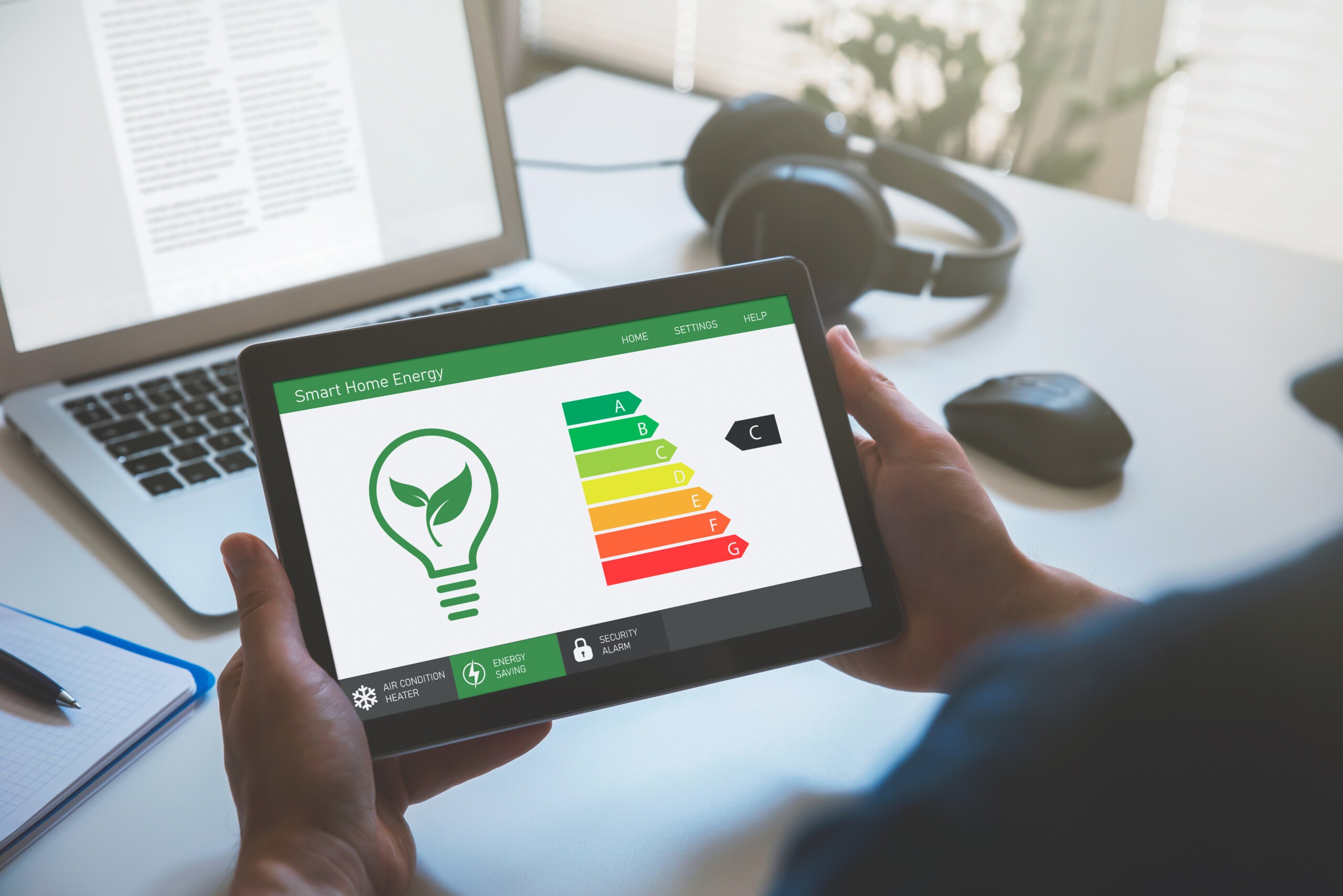 Energy efficiency mobile app on screen, eco house iStock 1341488371 scaled